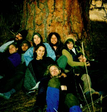 DEEP instructor Susanna Bahaar huddles with students at the base of the Sacred Tree in the Dakubetede Wilderness.